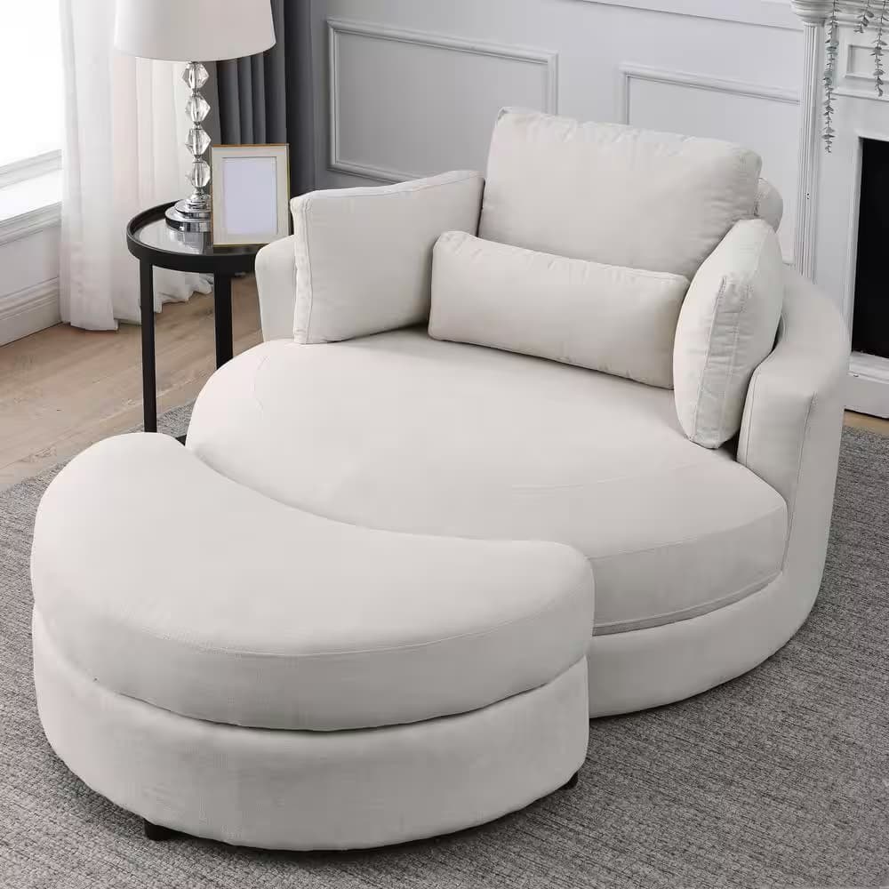 A contemporary, oversized round chaise lounge, upholstered in light-colored fabric, featuring a deep seat, high back with loose cushions, and a curved, complementary ottoman that fits snugly against the main unit. It appears to have a swivel base. — 3D model