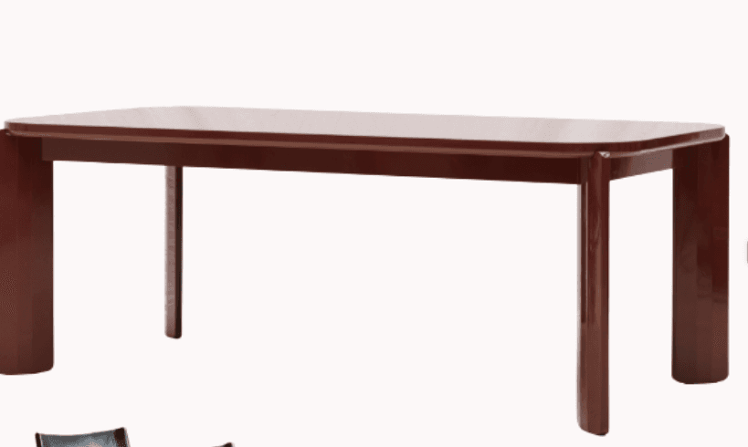 A rectangular dining table with a glossy dark red finish. The table features a slightly rounded rectangular top and four legs. The legs are solid and rectangular in cross-section, with rounded edges. The design appears modern and minimalist. — 3D model