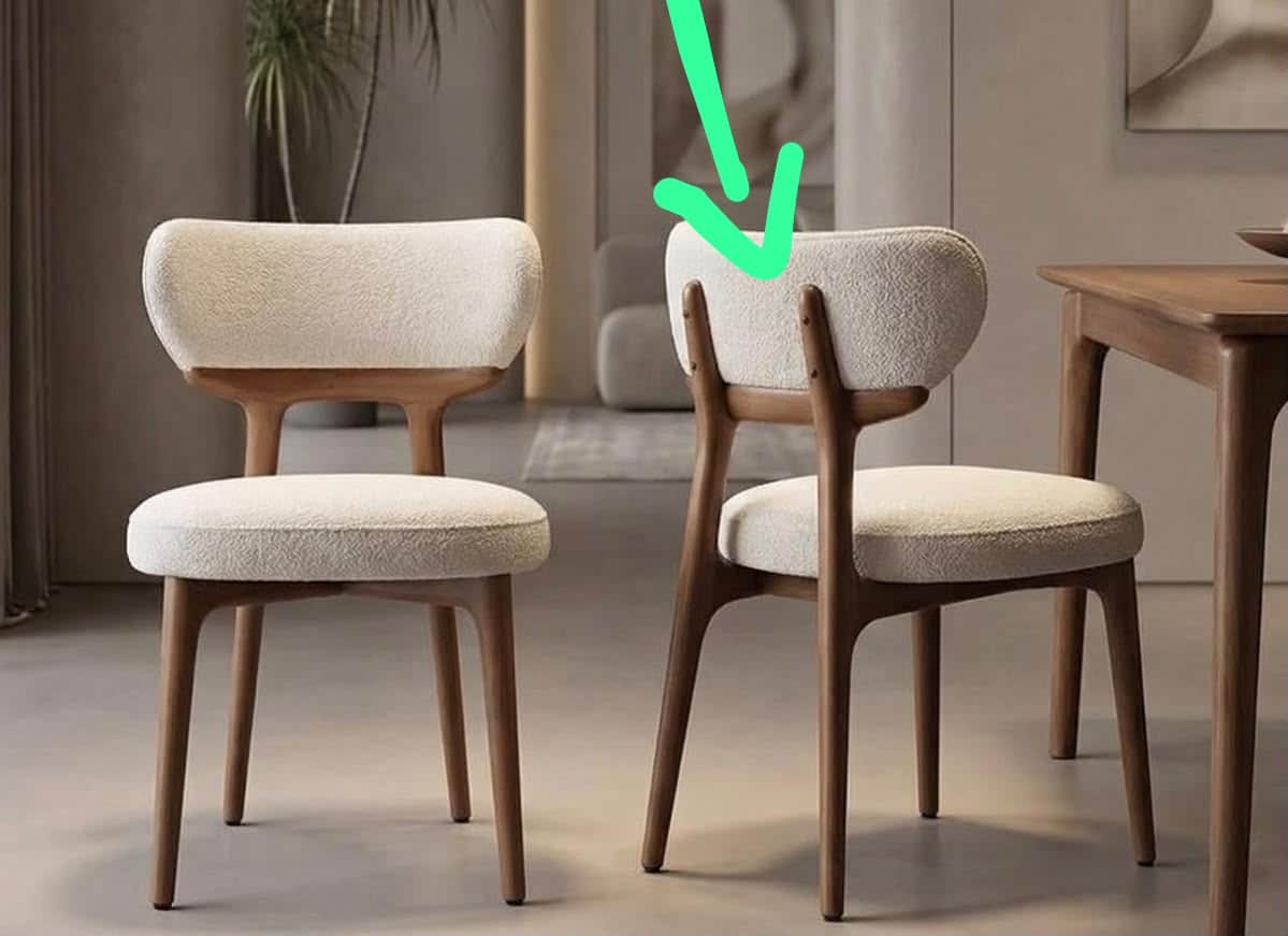 A contemporary dining chair featuring a light-colored, textured boucle fabric upholstery on both the… — 3D model