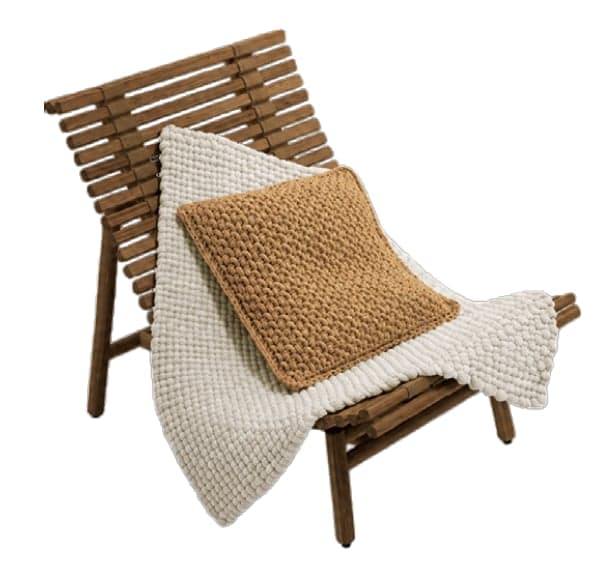 A modern reclining lounge chair constructed from parallel wooden slats, featuring a low profile and a natural wood finish. The chair is adorned with a textured off-white blanket and a chunky knit tan square pillow. — 3D model