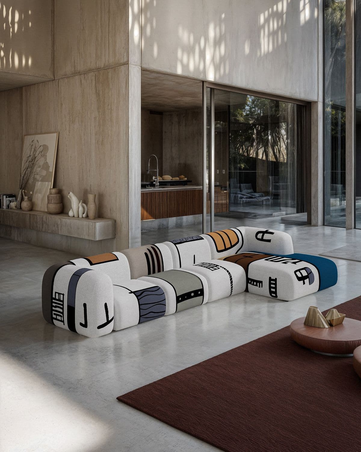 A modular sofa with a unique, abstract design. Each module is upholstered in fabric featuring various graphic patterns and symbols, resembling a playful, artistic aesthetic. The sofa is configured in a sectional arrangement, suggesting flexibility in its layout. The overall shape is curvilinear and modern. — 3D model