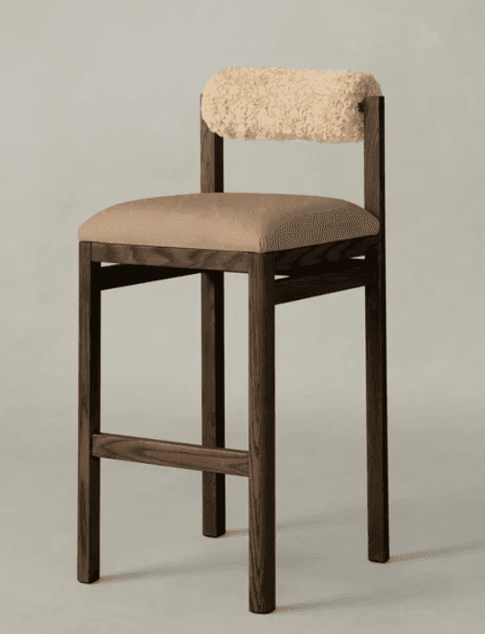 A modern bar stool with a dark wood frame. The seat is upholstered in a smooth, neutral-toned fabric… — 3D model