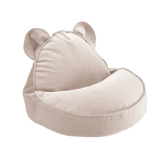 A children's bean bag chair featuring a plush, light beige fabric cover and whimsical bear ear details integrated into the top of the backrest, designed for casual and comfortable seating. — 3D model