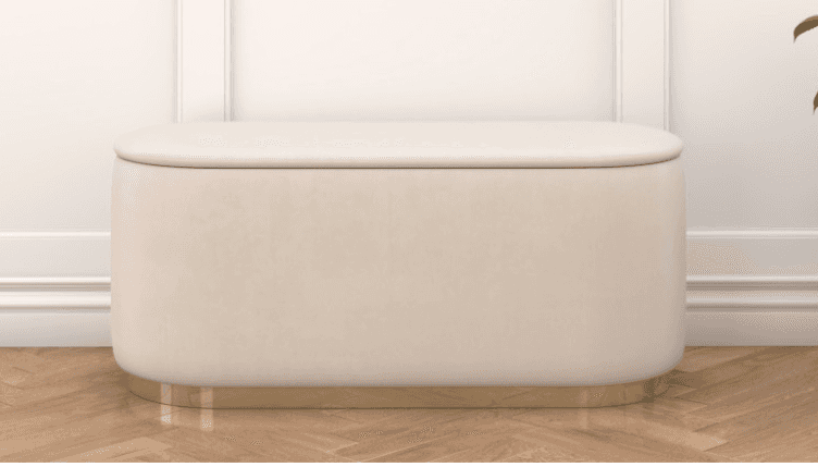 A rectangular ottoman with rounded corners, upholstered in a soft, cream-colored fabric. It features… — 3D model