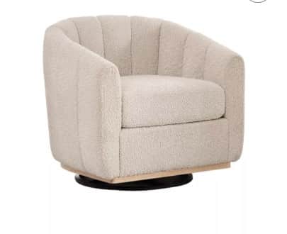 A swivel armchair with a rounded, barrel-shaped back and arms. The upholstery features a textured, p… — 3D model