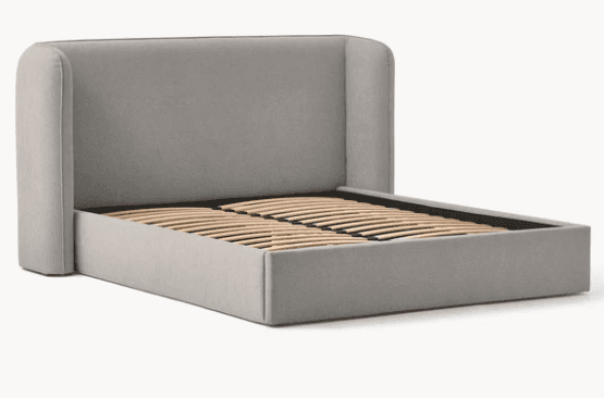 A light gray upholstered bed frame featuring a distinctive wingback headboard and a wooden slat supp… — 3D model
