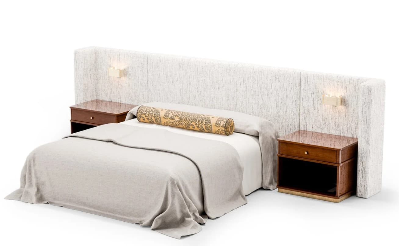 A modern king-sized bed featuring a large, paneled upholstered headboard in a light, textured fabric. The headboard extends horizontally to seamlessly integrate two dark wood nightstands, each with a single drawer and an open shelf, accented by a subtle metallic base trim. Two wall-mounted sconce lights are also integrated into the headboard. The bed is dressed with light-colored bedding and a decorative bolster pillow with an intricate pattern. — 3D model