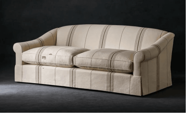 A cream-colored two-seater sofa with a brown ticking stripe pattern, featuring rolled arms and a tailored skirted base. — 3D model