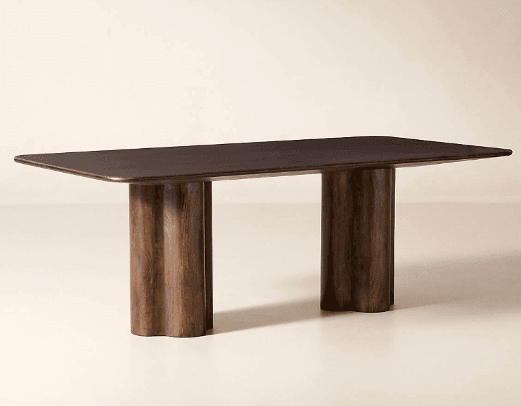 A dark stained wooden dining table featuring a rectangular top with rounded corners, supported by two cylindrical pedestal bases with vertical fluting. — 3D model