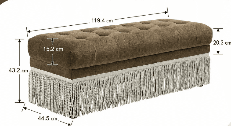 A rectangular upholstered bench featuring deep button tufting on the top surface and a decorative fringe trim along the bottom edge. The main body is covered in a textured brown fabric, and the fringe is a lighter, possibly cream or light grey, textile. The bench appears to sit on small, concealed feet. — 3D model