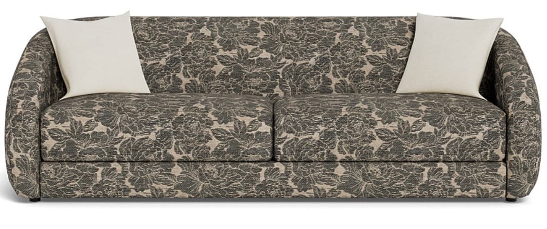 A contemporary sofa fully upholstered in a dark beige and grey botanical pattern fabric. It features a streamlined form with gently rounded track arms and two loose seat cushions. The sofa comes with two light-colored square toss pillows. — 3D model