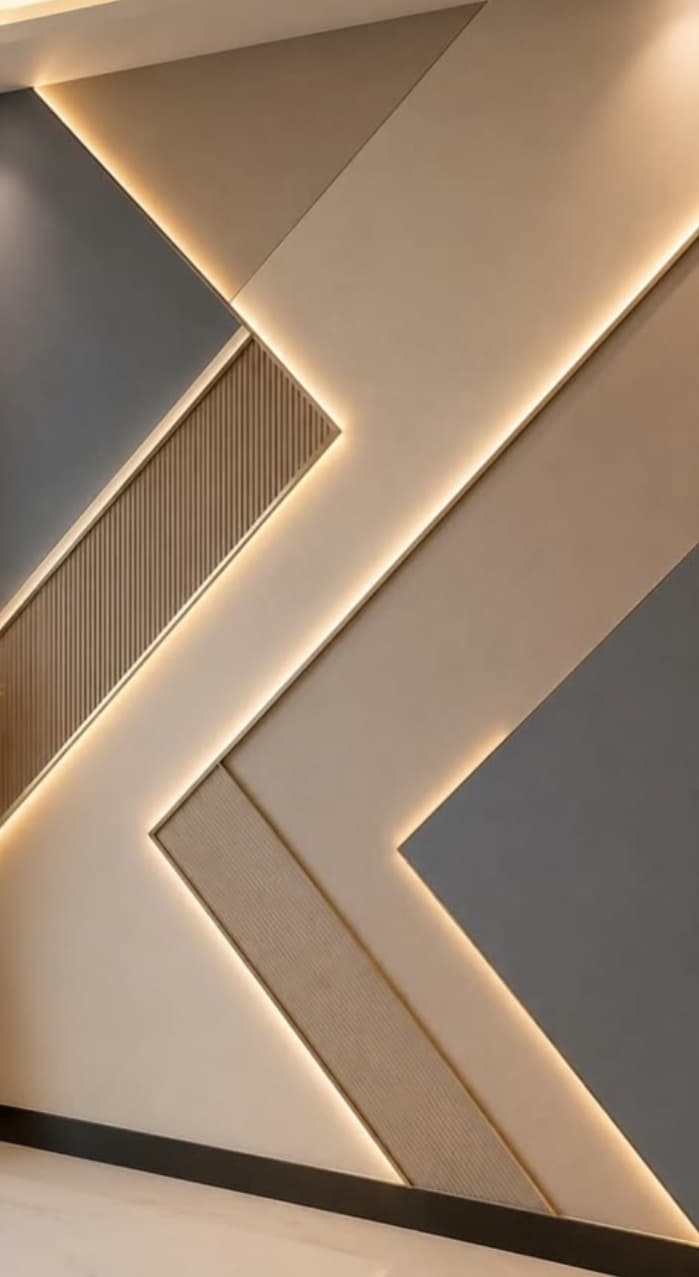 A rectangular decorative wall panel featuring an abstract, asymmetrical geometric design with integrated LED backlighting. The panel consists of various shapes and textures, including smooth matte surfaces in beige and gray, and grooved sections, all framed by gold-toned linear accents. Warm white LED strips are embedded along the edges of some geometric forms, casting a soft ambient glow. — 3D model