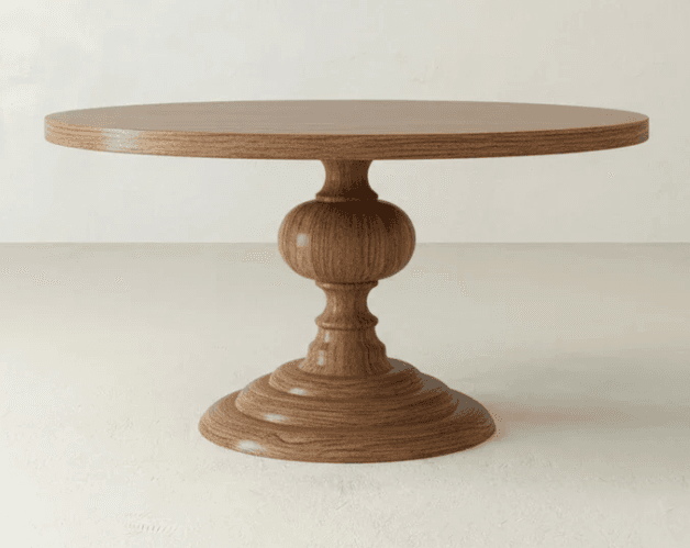 A round pedestal table with a substantial, carved wooden base. The tabletop is circular and flat. The base features a series of stacked, turned, and bulbous elements, culminating in a wide, circular foot. The wood grain is prominent, suggesting a natural finish. — 3D model