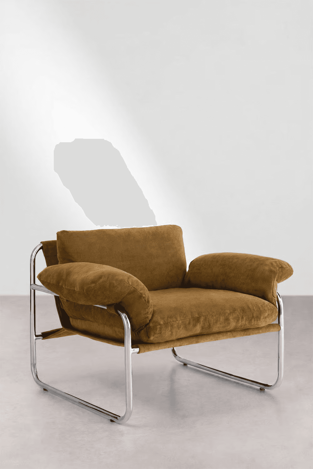 A modern lounge armchair featuring a polished tubular chrome frame and plush, warm brown upholstered… — 3D model