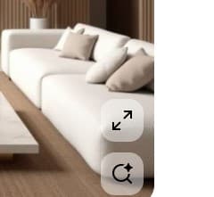 A modern, modular white sofa with deep, plush cushions. The sofa appears to be constructed from fabric with a textured finish. It is configured as a sectional, with visible seams suggesting individual modules. Several throw pillows in neutral tones are placed on the sofa. — 3D model