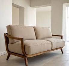 A two-seater upholstered loveseat featuring an exposed wooden frame and light beige fabric cushions. — 3D model