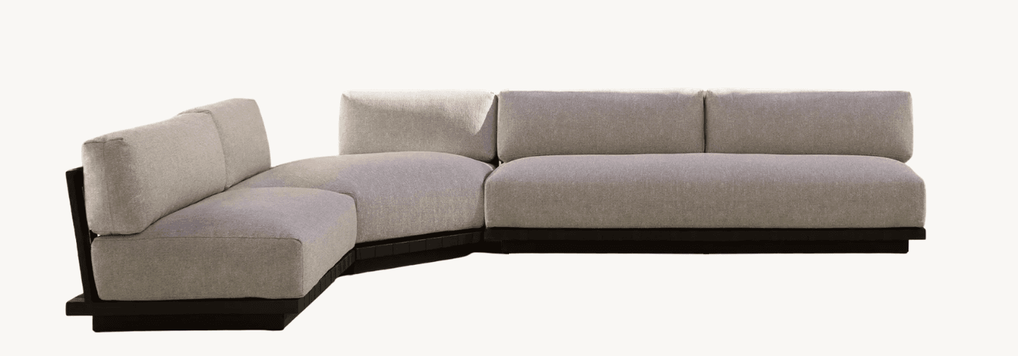 A contemporary L-shaped sectional sofa featuring light grey fabric upholstery and a dark wooden platform base, designed with a low-profile silhouette. — 3D model