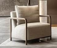 A modern armchair featuring a sleek, exposed metal frame and generously upholstered cushions. The fr… — free BLEND 3D model