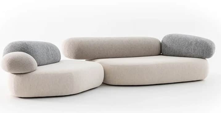 A modular sectional sofa with rounded, organic forms, resembling pebbles or stones. The sofa feature… — 3D model
