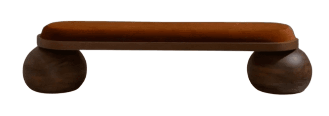 A contemporary bench featuring a long, rectangular seat with rounded ends, upholstered in a rich terracotta-colored velvet fabric. The seat rests upon two large, spherical legs made from dark, grain-visible wood. The overall design is minimalist yet sculptural, highlighting the distinct shapes and textures of its components. — 3D model