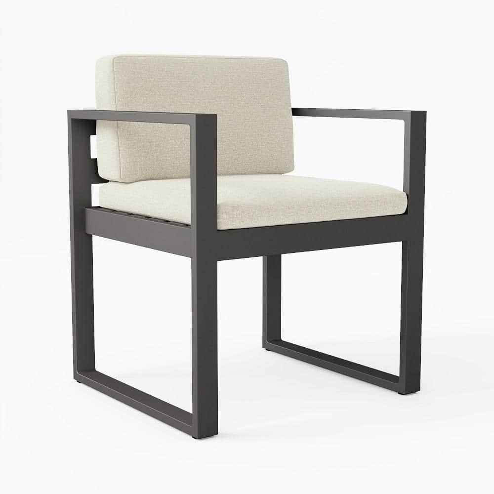 A modern armchair characterized by a dark-colored metal frame with a rectangular profile, featuring… — 3D model