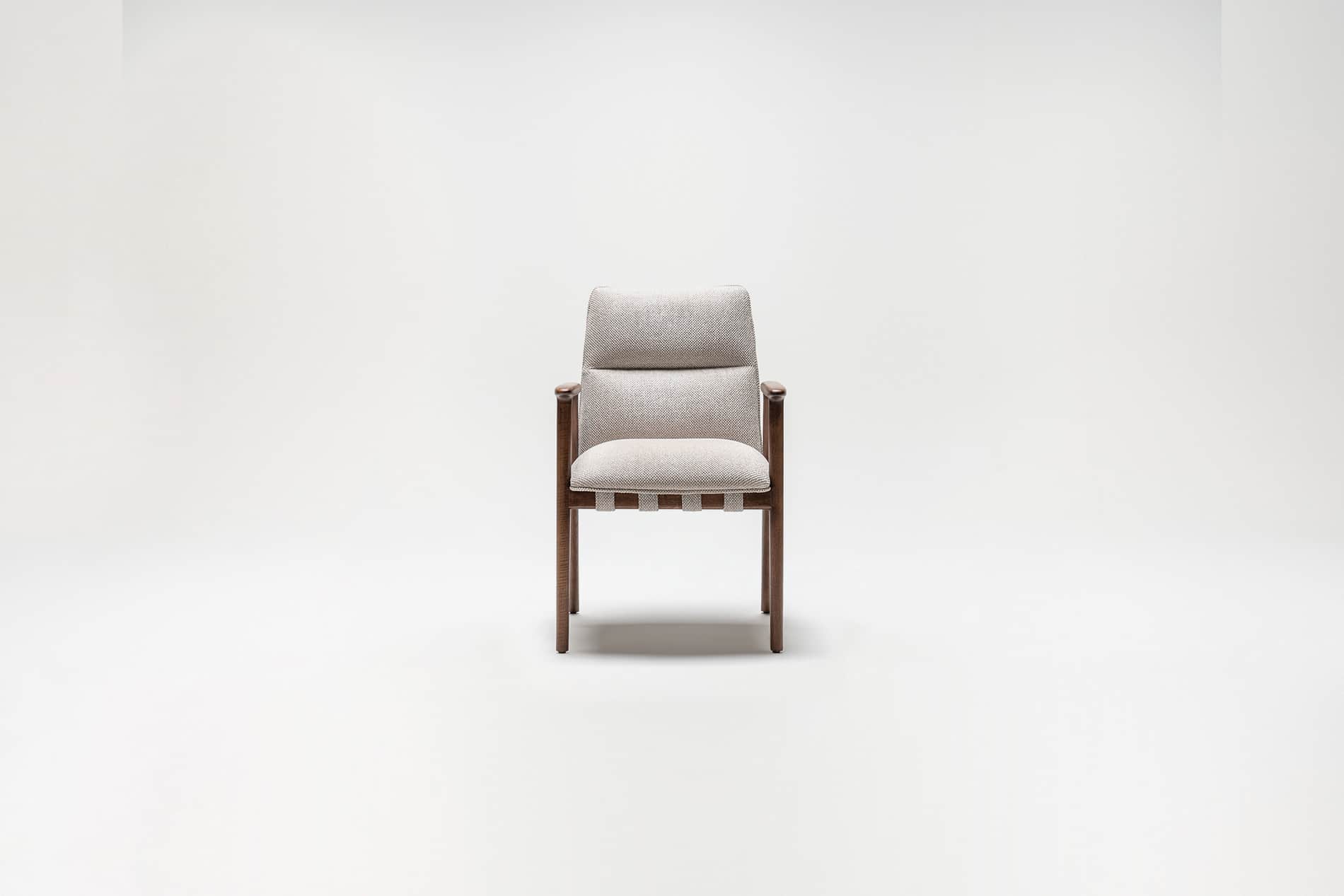 A modern armchair with a wooden frame and upholstered seat and backrest. The seat is supported by wo… — free OBJ 3D model