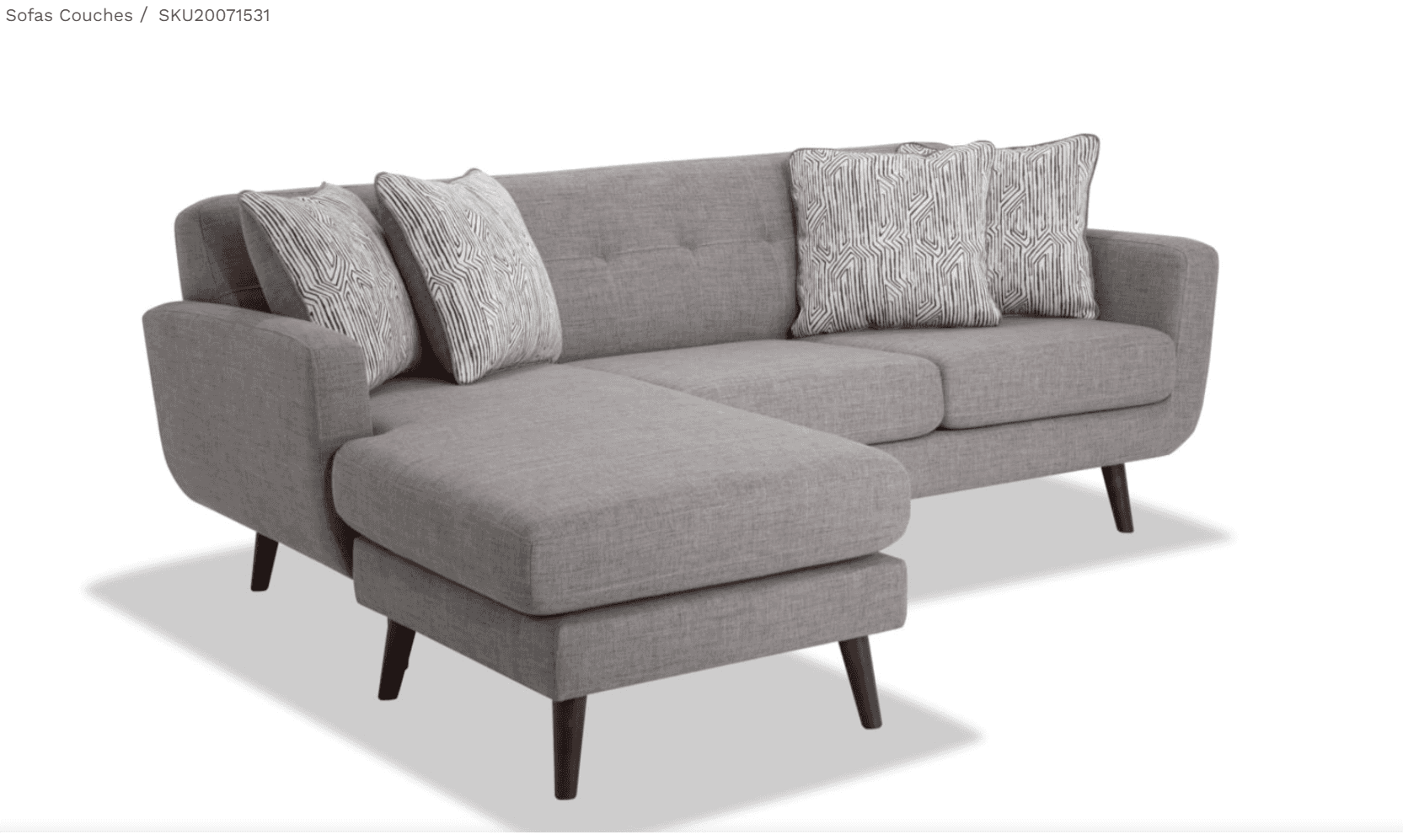 A contemporary gray fabric sectional sofa featuring a reversible chaise lounge. The sofa has clean l… — 3D model