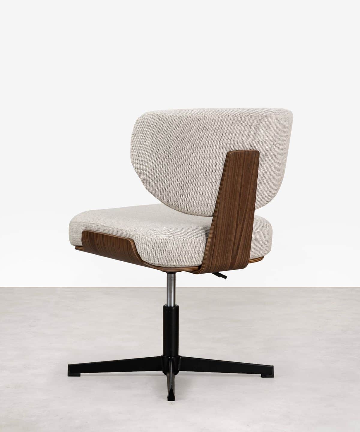 An upholstered swivel chair featuring a distinct curved bentwood shell that forms the lower back and… — free BLEND 3D model