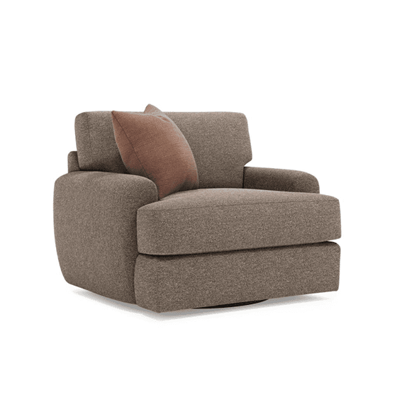 A contemporary, upholstered armchair with a visible circular swivel base, featuring a deep seat, wide track arms, and a loose back cushion, accompanied by a contrasting throw pillow. — 3D model