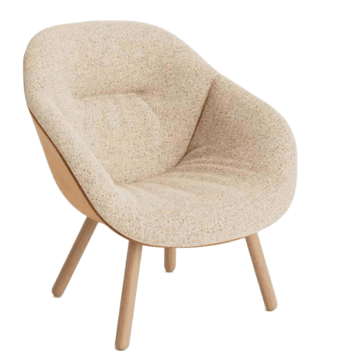 A contemporary upholstered lounge chair featuring a rounded, integrated shell design. The interior is covered in a light, speckled fabric, while the exterior shell appears to be a smooth, light tan material, possibly molded wood or plastic. The chair is supported by four splayed, tapering light wood legs. — 3D model