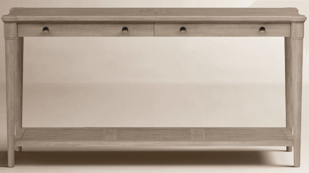 A slender console table with a rectangular top and four tapered legs. The table features two drawers with simple, round metal pulls. The lower shelf has a woven cane insert with a linear pattern. — 3D model