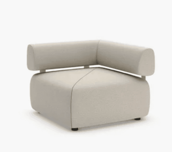 A modern, modular corner armchair upholstered in a light beige textured fabric, featuring a distinctive L-shaped backrest supported by a subtle metal frame. — 3D model