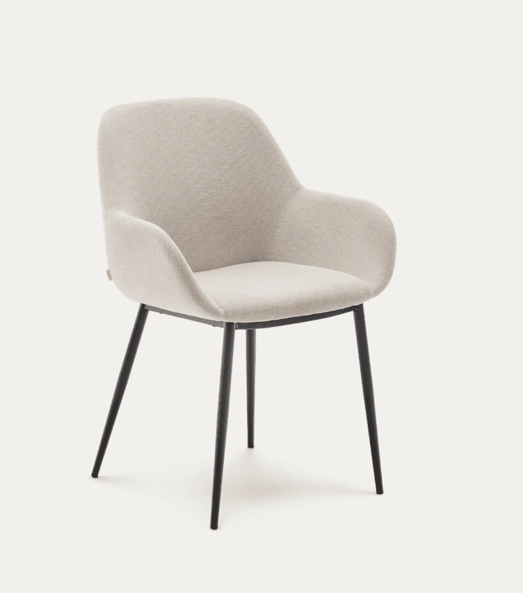 An upholstered contemporary dining armchair featuring a gently curved shell design and sleek, tapered metal legs. The chair is covered in a light beige, subtly textured fabric and stands on four black metal legs that splay slightly outwards. The integrated armrests and back form a continuous, supportive shape. — 3D model