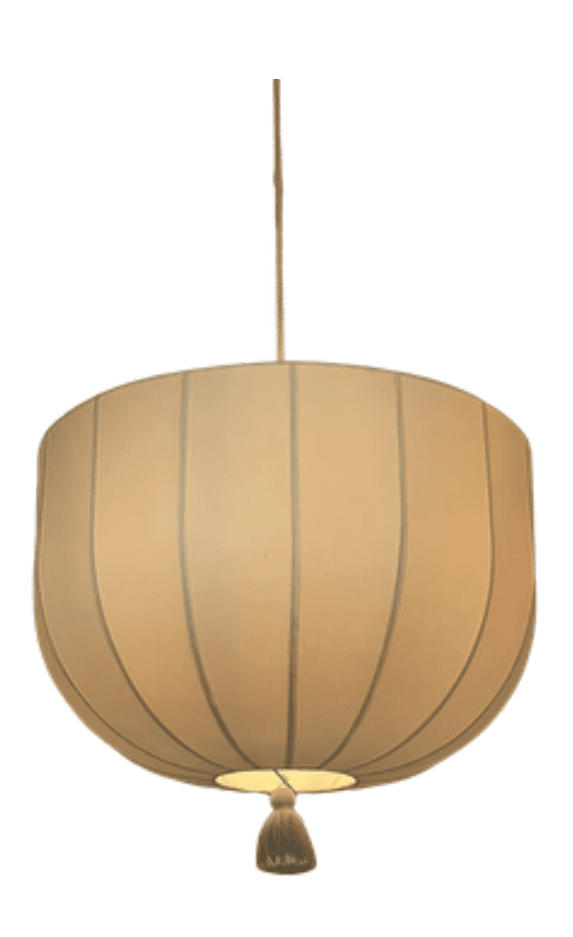 A pendant light fixture featuring a drum-shaped shade with vertical pleats or seams. The shade appears to be made of a fabric material and is suspended by a cord. A decorative tassel is attached to the bottom center of the shade. — 3D model