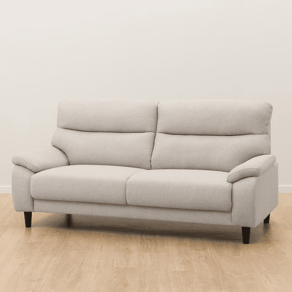 A light beige, modern two-seater sofa featuring plush, rounded cushioning and adjustable headrests for enhanced comfort. It has subtly tapered dark wooden legs and rolled, padded armrests. The sofa appears to be upholstered in a woven fabric. — 3D model