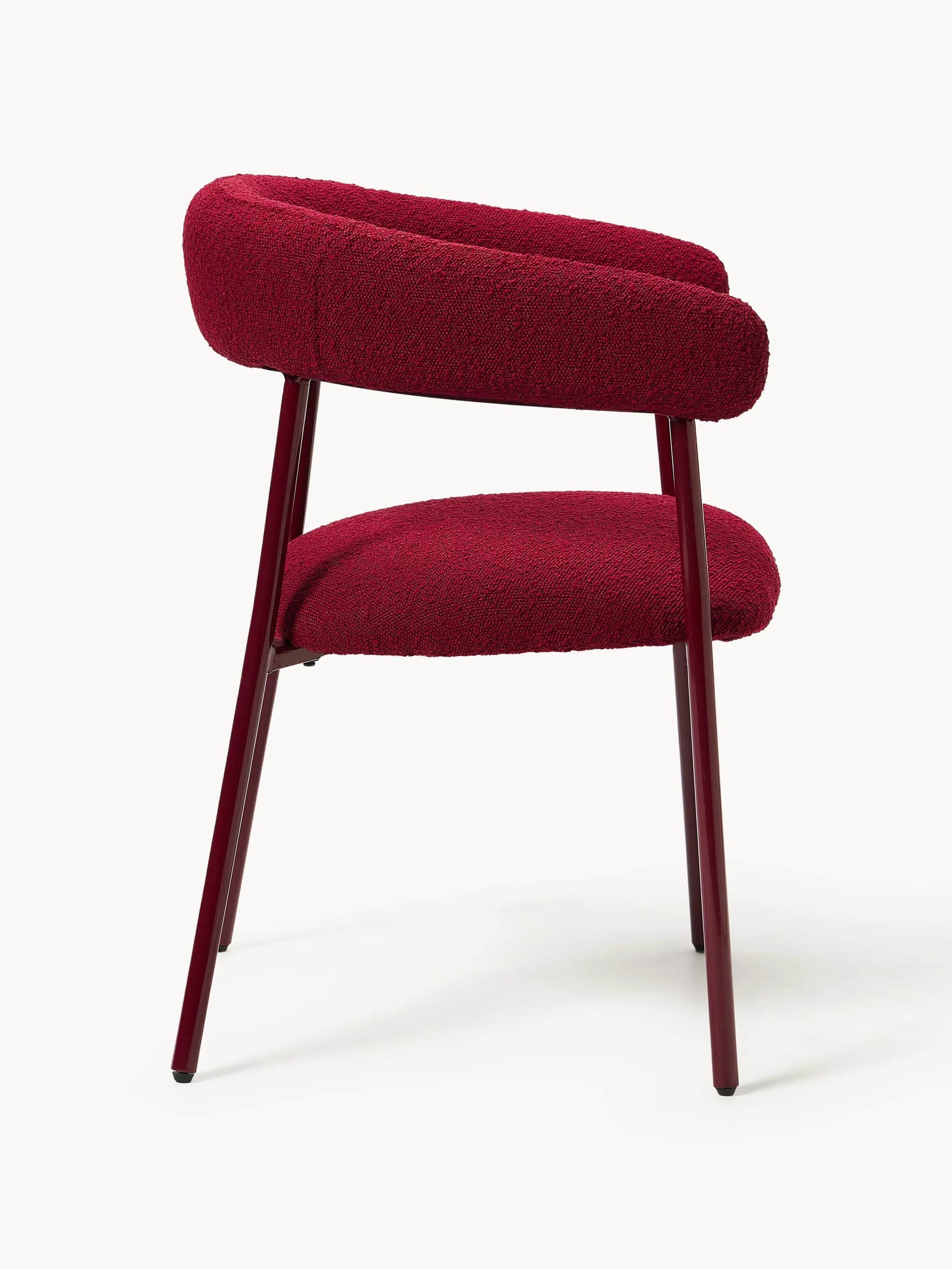 A modern armchair with a curved backrest that extends into armrests. The seat and back are upholster… — 3D model