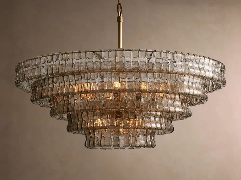 A multi-tiered chandelier with a tiered, cascading design. The fixture features numerous individual rectangular glass elements that are strung together to form stacked, curved tiers. The glass appears textured and semi-transparent, allowing light to diffuse through it. A central golden chain suspends the fixture. — 3D model