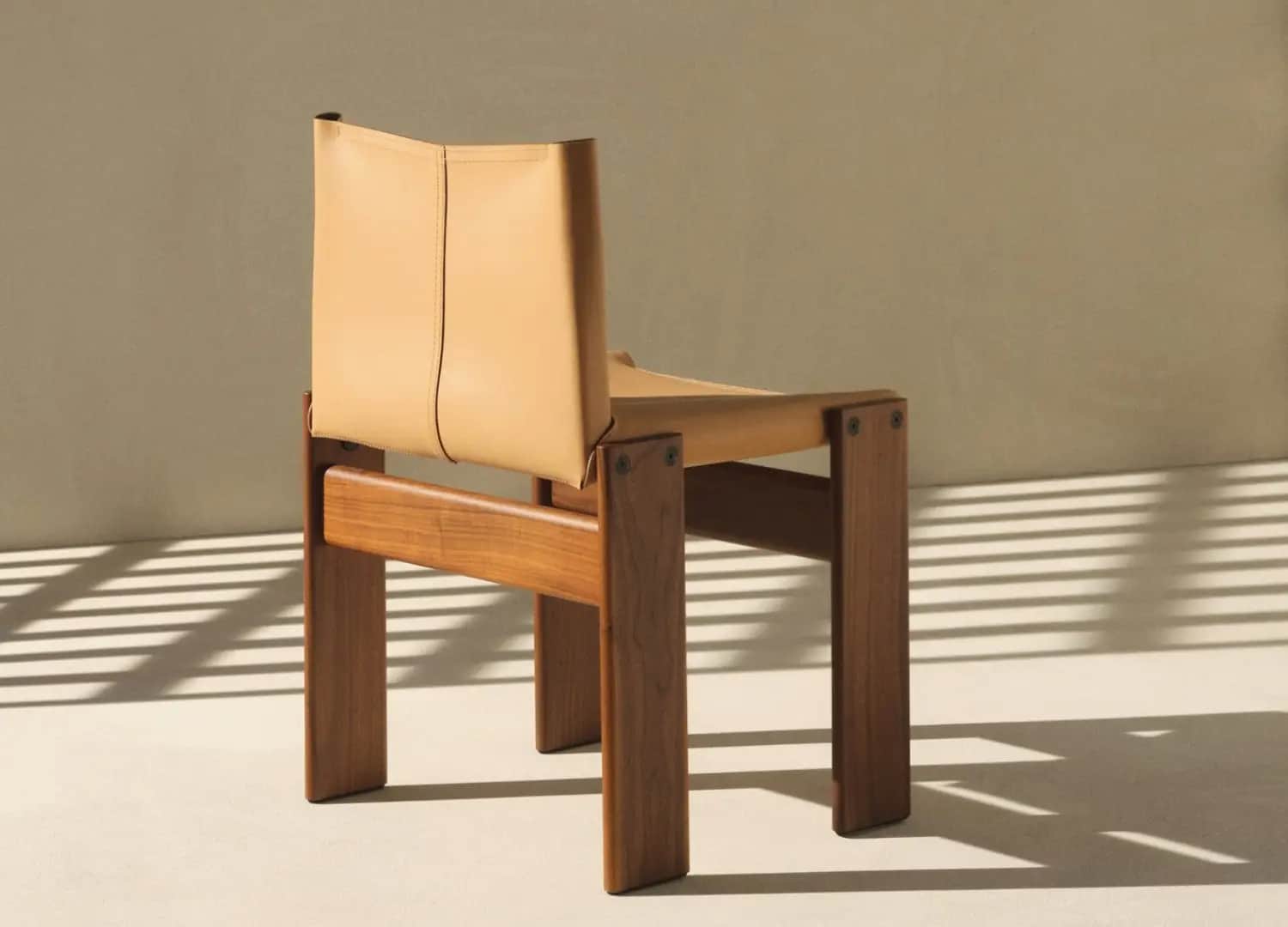 A low-profile lounge chair featuring a sturdy, rectilinear wooden frame and a minimalist sling const… — free GLB 3D model