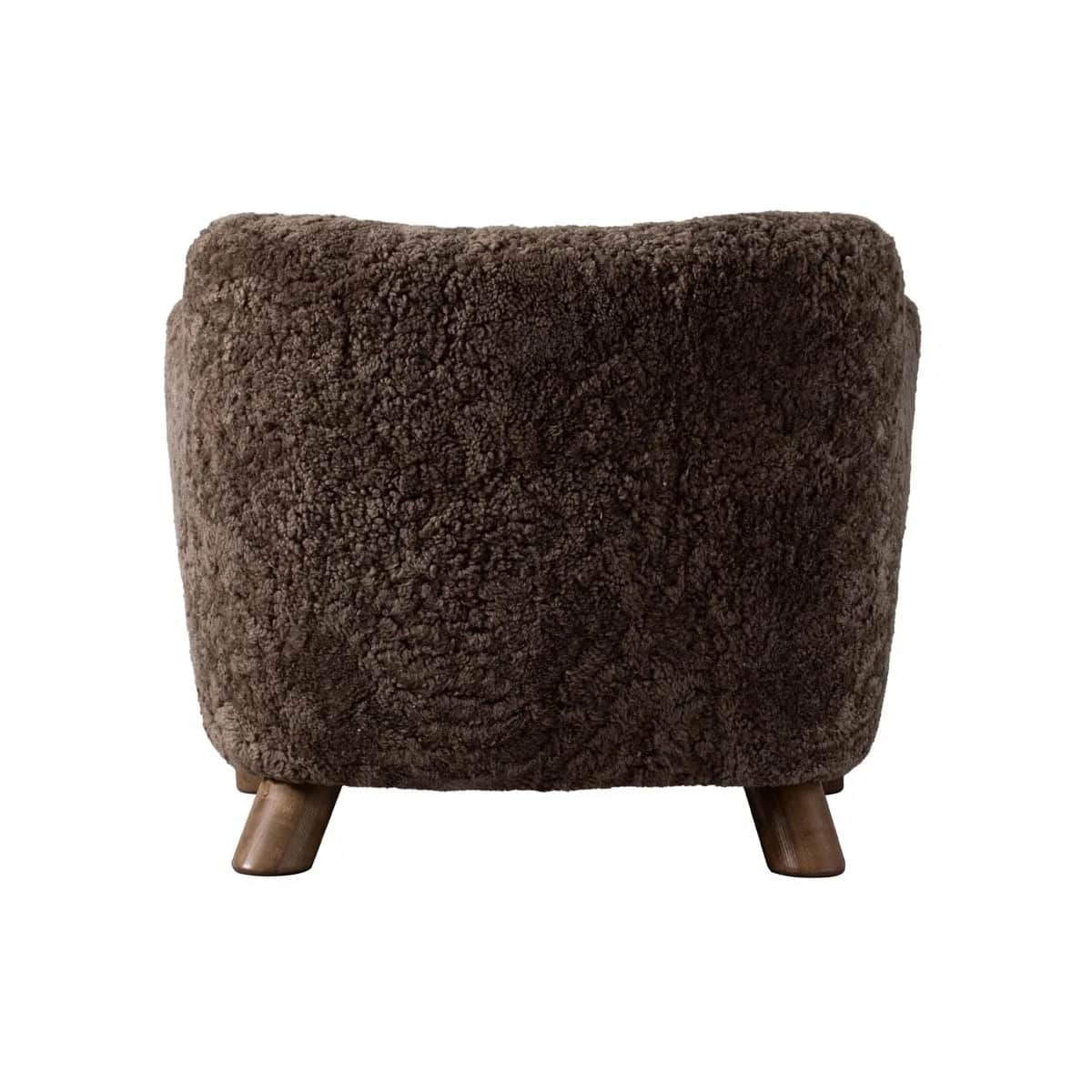 A barrel-shaped ottoman upholstered in dark brown, curly sheepskin or a high-pile faux sheepskin mat… — 3D model