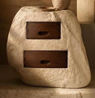 A unique nightstand or small storage unit designed to resemble a natural, light-colored rock or ston… — 3D model