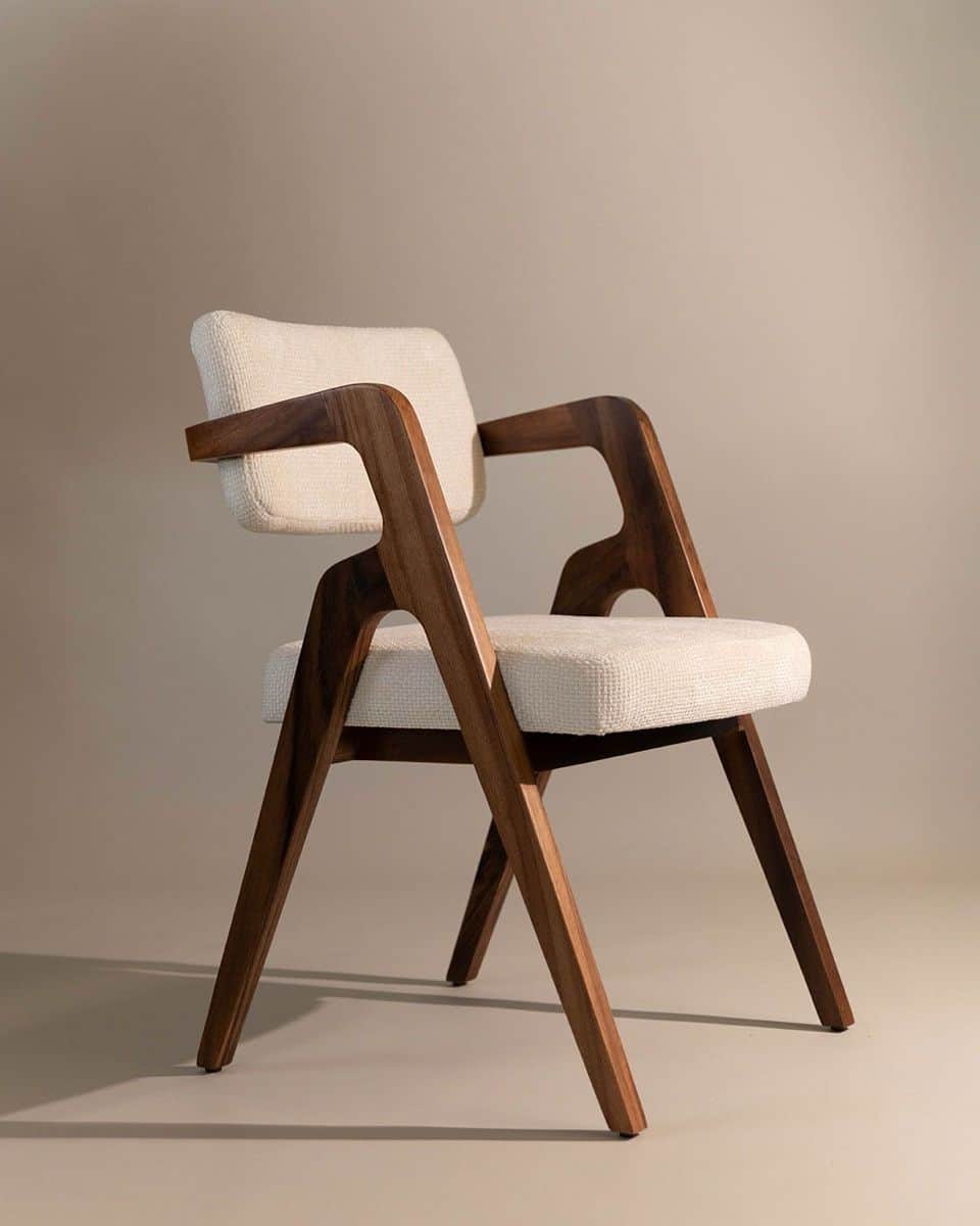 A stylish mid-century modern inspired dining armchair featuring a dark walnut-stained solid wood fra… — 3D model