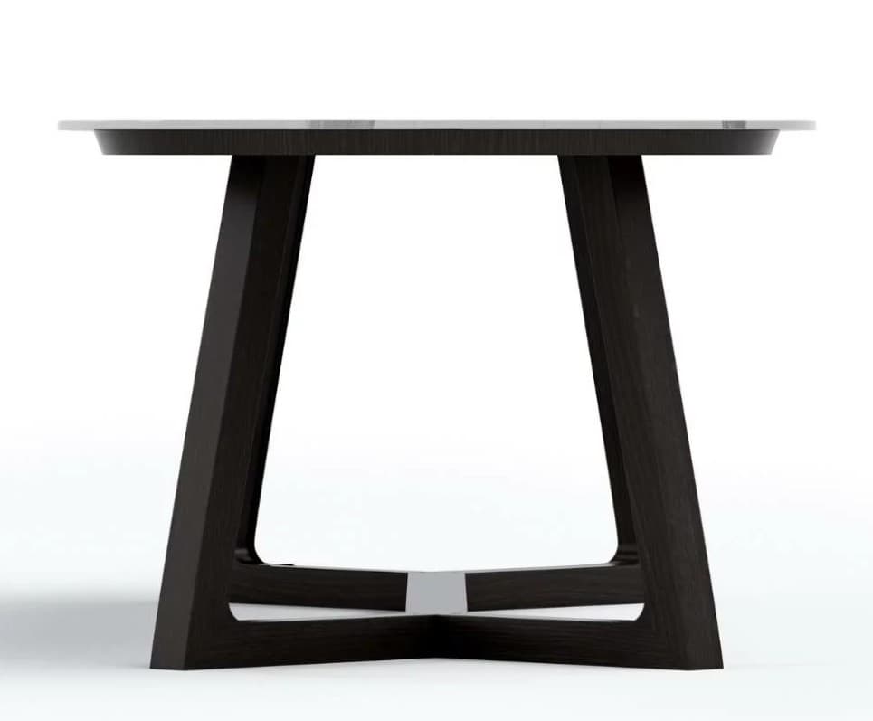 A modern dining table with a rectangular top and a dark wood base. The base features two angled legs connected by a lower stretcher with metal accents. The tabletop has a subtle bevel around its edge. — 3D model