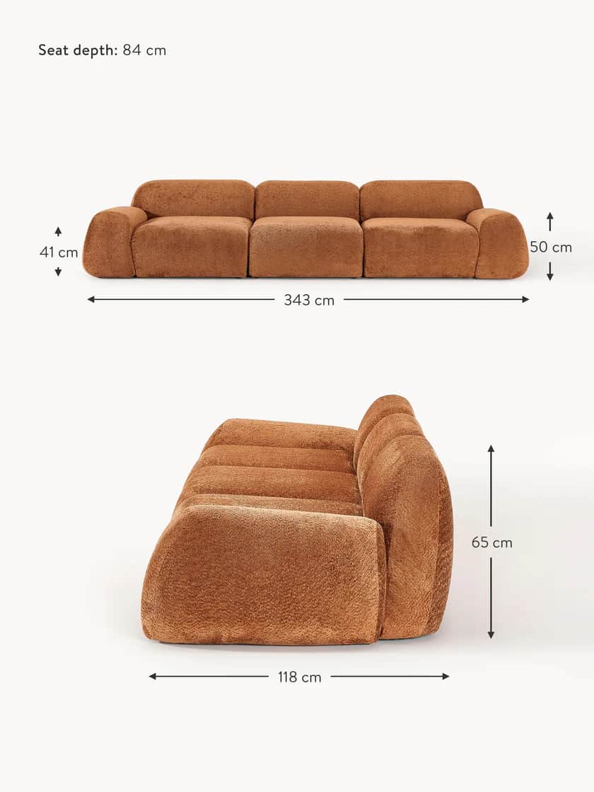 A low-profile, modular three-seater sofa with rounded edges and a plush, textured upholstery. The so… — free OBJ 3D model