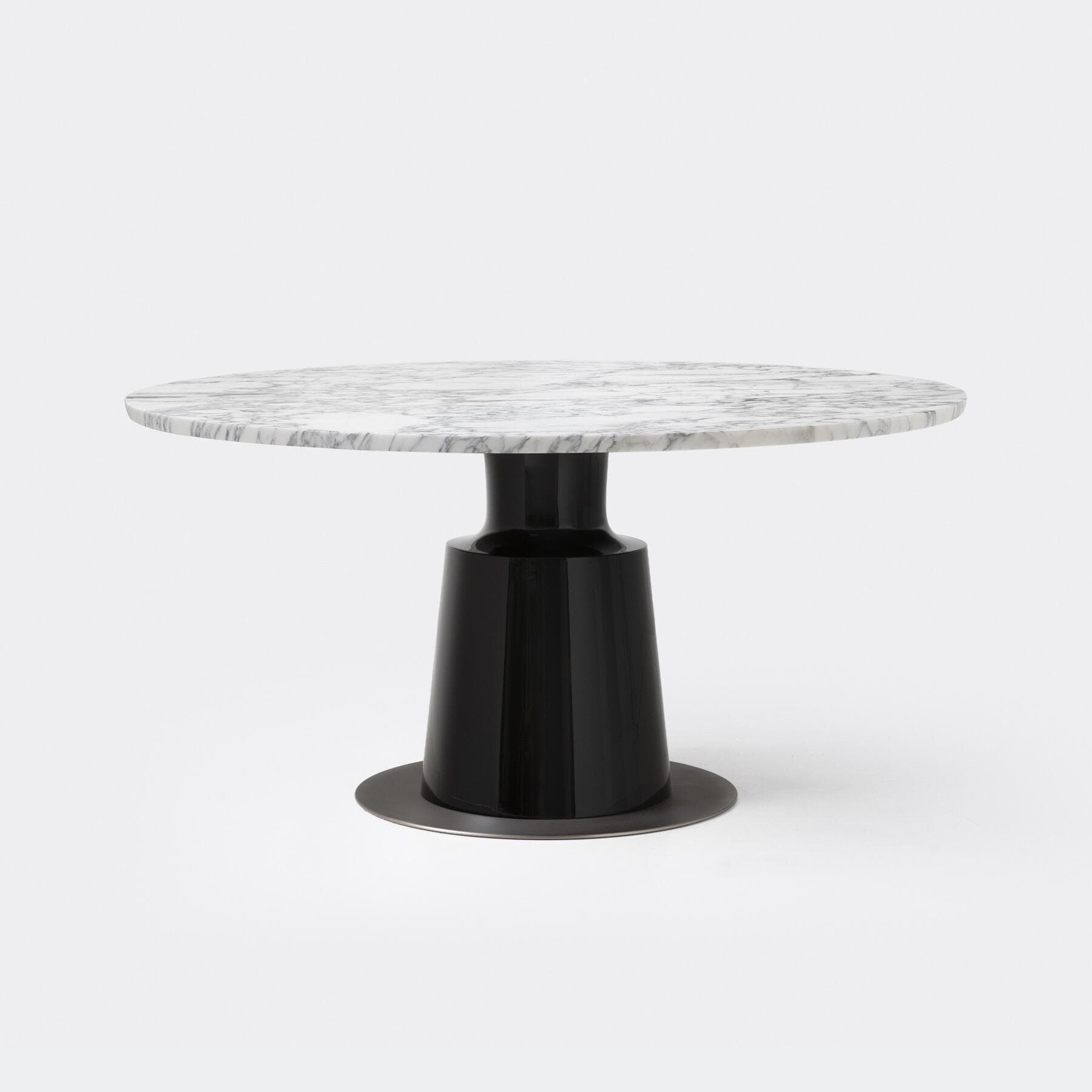 A modern round table featuring a white marble top with grey veining, supported by a glossy black, tapered pedestal base, which rests on a circular dark metal plate. — 3D model