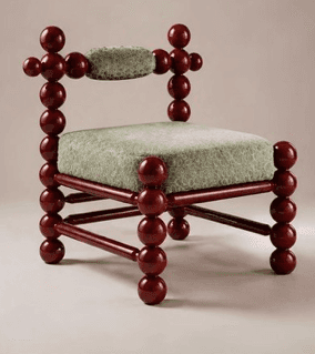 A unique postmodern accent chair featuring a frame constructed from numerous spherical, dark red lac… — 3D model