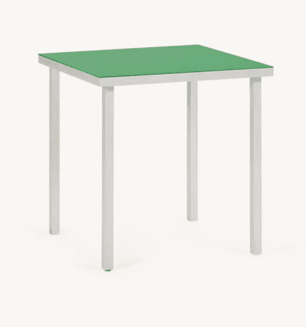 A square side table with a green top and four slender, white legs. The legs are angled inwards slightly towards the top, creating a minimalist and modern aesthetic. — 3D model