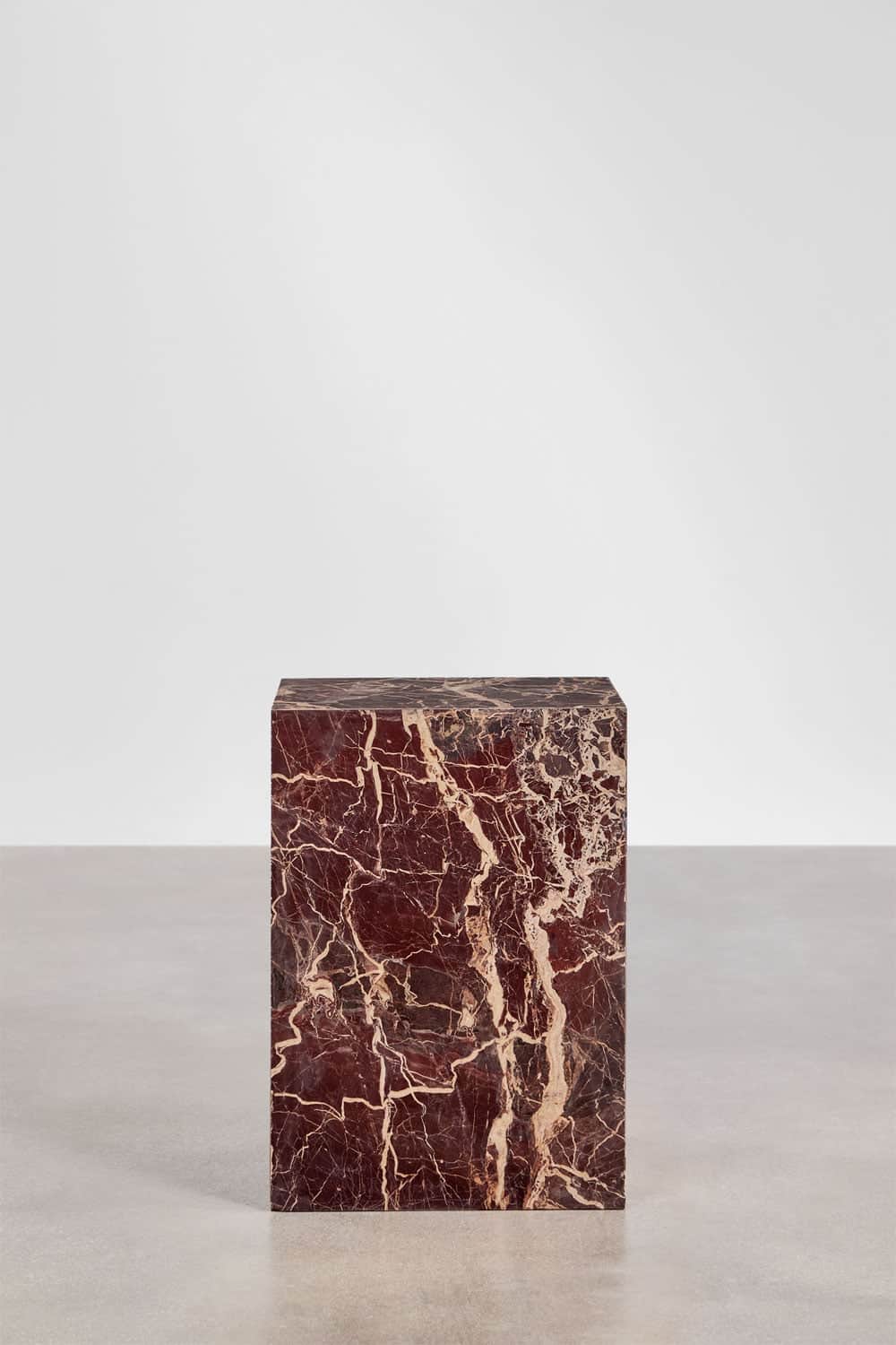 A rectangular pedestal with a block form, crafted from dark red marble featuring intricate white vei… — 3D model