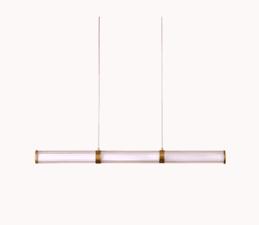 A modern linear pendant light featuring a clear glass or acrylic cylindrical shade housing an intern… — 3D model