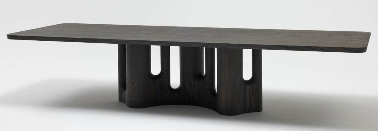 A contemporary coffee table crafted from dark-stained wood, featuring a rectangular tabletop with su… — 3D model