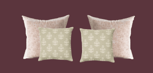 Two pairs of decorative cushions are presented against a solid dark pinkish-purple background. The front pair consists of two square cushions in a pale green hue, each adorned with a repeating pattern of white, stylized floral or anchor-like motifs. The back pair comprises two rectangular cushions, appearing slightly larger and positioned behind the square ones. These cushions are a light pink color with a subtle, all-over floral pattern in a slightly darker pink. The edges of the rectangular cushions have a white border. — 3D model